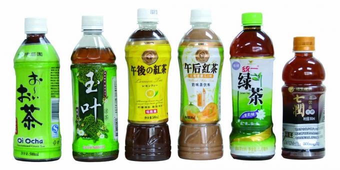 Applicateur automatique d'étiquette de douille de rétrécissement de bouteille de deux côtés pour l'eau minérale